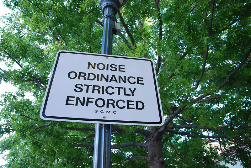 Sign that says "Noise Ordinance Strictly Enforced."
